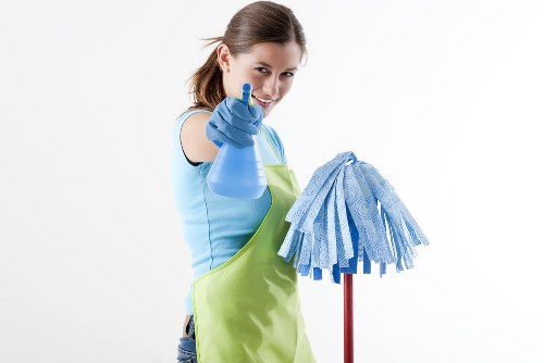 Cleaning professional applying safety measures during a deep clean